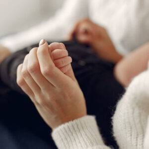 Elegant grandma at home with daughter and grandson